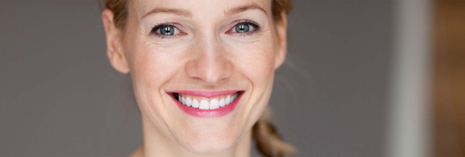Closeup of a woman smiling with white teeth